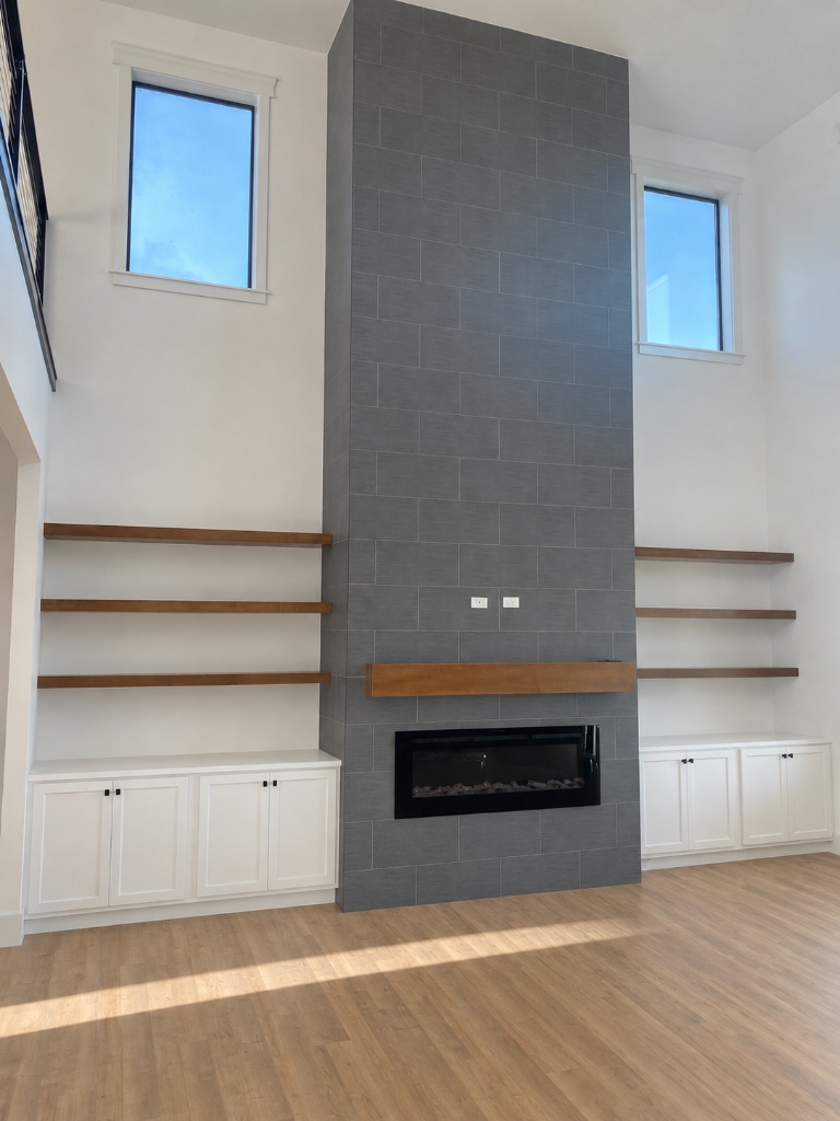 Modern Tiled Fireplace with Custom Floating Wood Mantel and Built-Ins