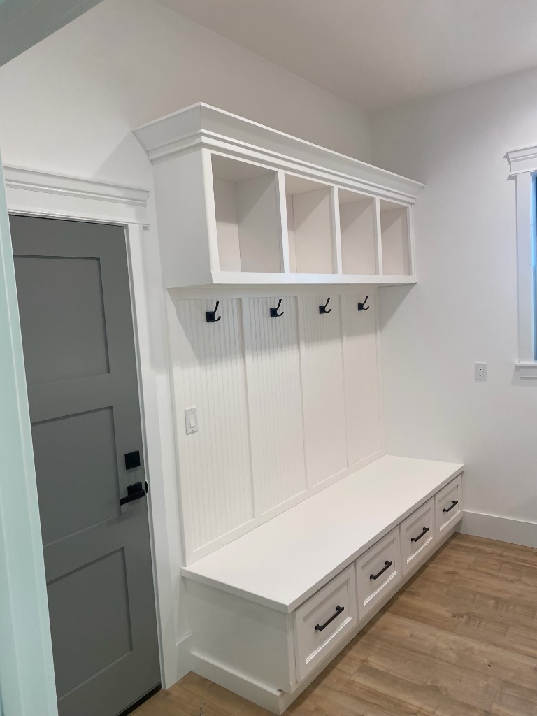 Custom White Beadboard Mudroom Built-In Bench with Storage Drawers
