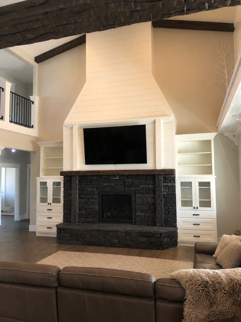 2-Story Shiplap Fireplace with Custom Built-In Bookcases