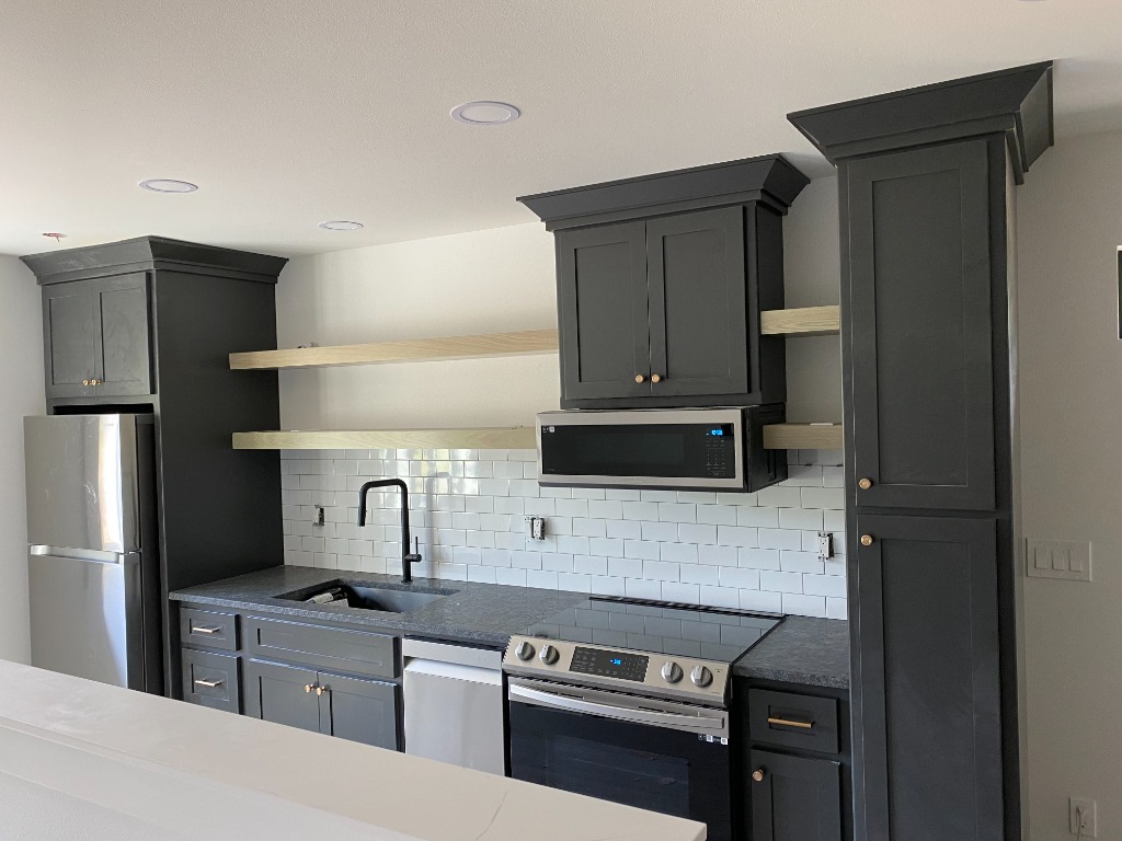 Modern Charcoal Cabinetry Suite with Natural Oak Floating Shelves