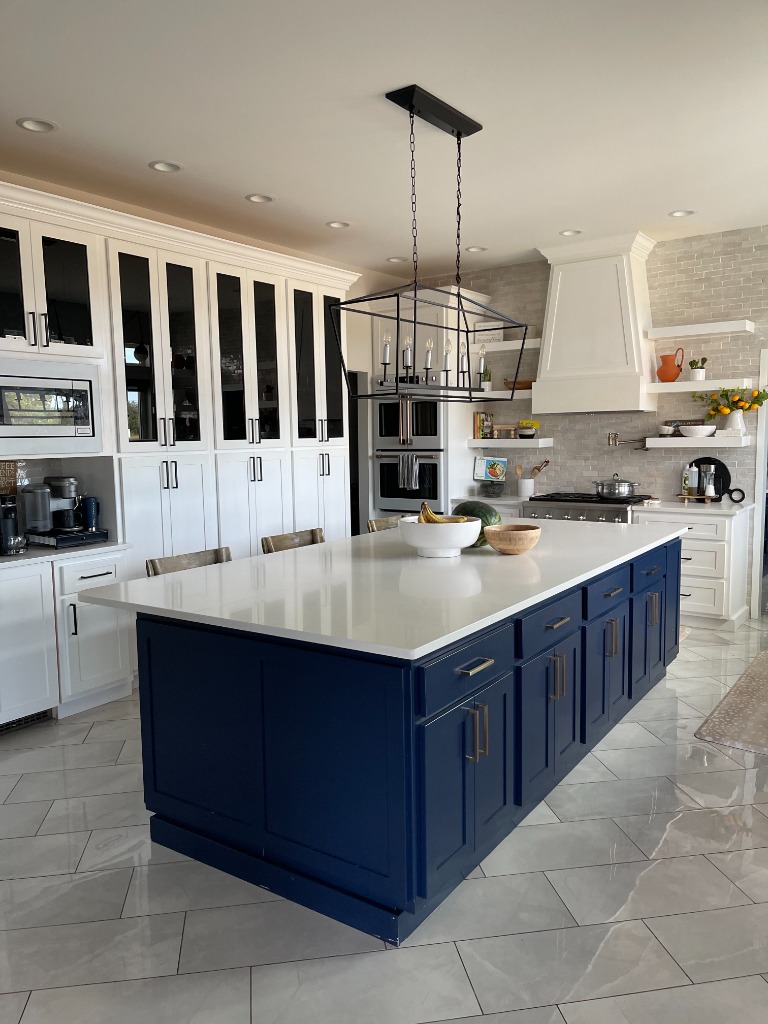 Statement Navy Blue Island Kitchen with Quartz Countertop