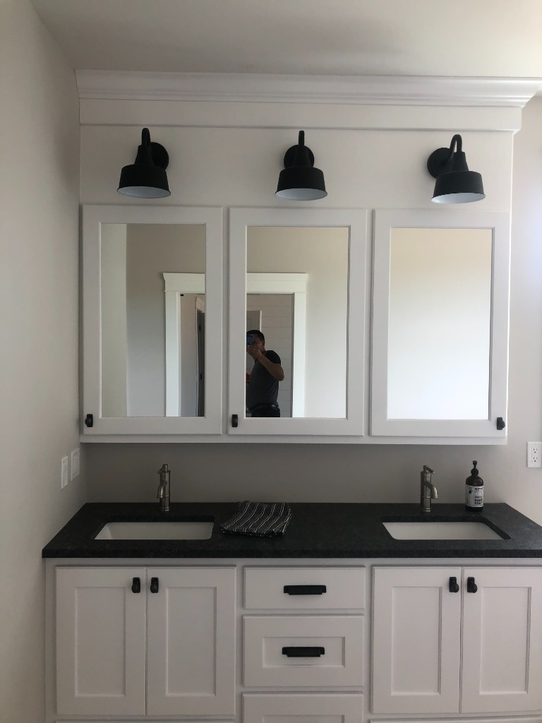 Custom White Shaker Double Vanity with Crown-Molded Medicine Cabinets