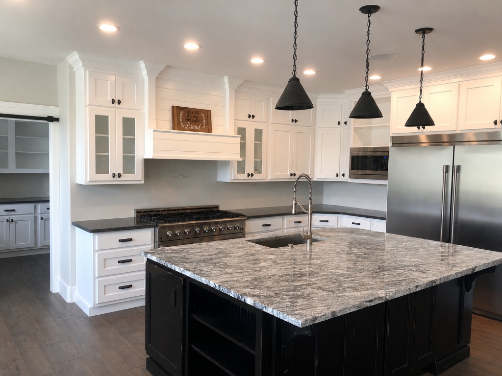 Grand Gourmet Kitchen with Custom Shiplap Range Hood