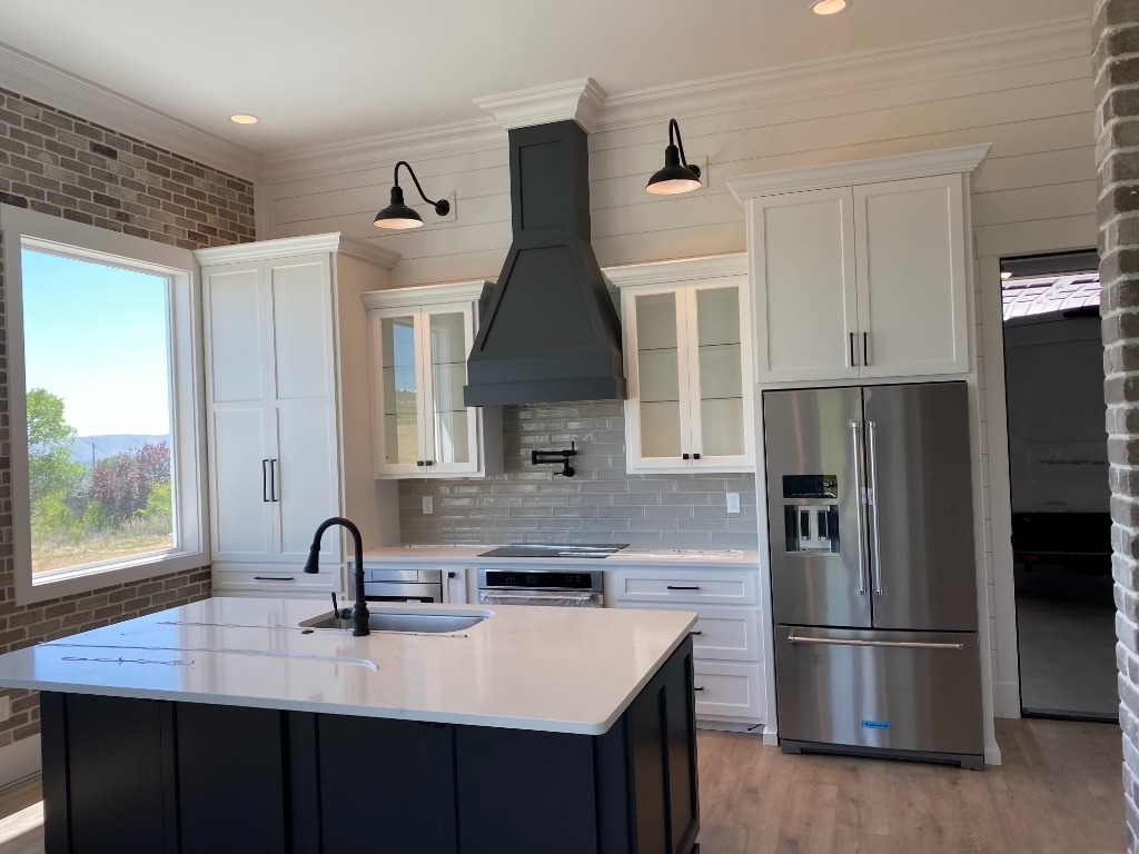 Modern Farmhouse Kitchen with Custom Matte Black Range Hood and Island
